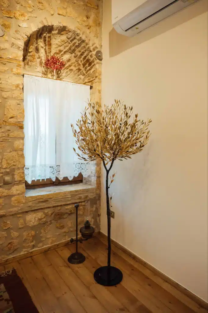 Cosy corner with a window and a dried olive branch decoration, Valaes Guesthouse, Foiniki