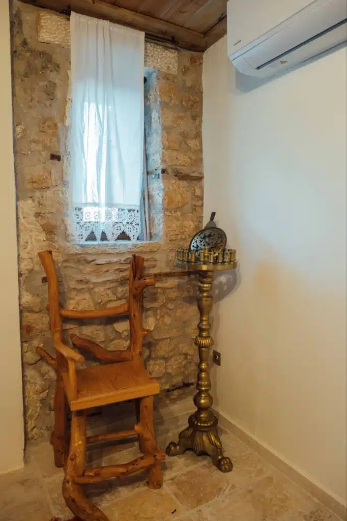Cosy interior corner with a curtained window and a wooden chair, Valaes Guesthouse, Foiniki