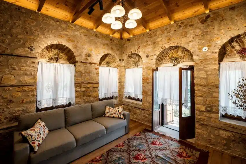 Cosy living room with fireplace at Valaes Guesthouse, Foiniki