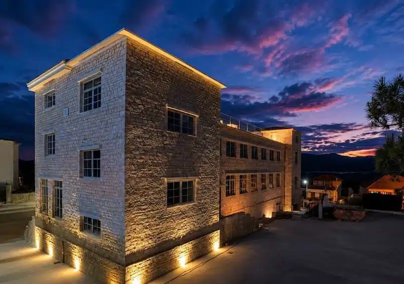 Historic Bulgari School and Museum in Paramythia, Greece, at sunset.