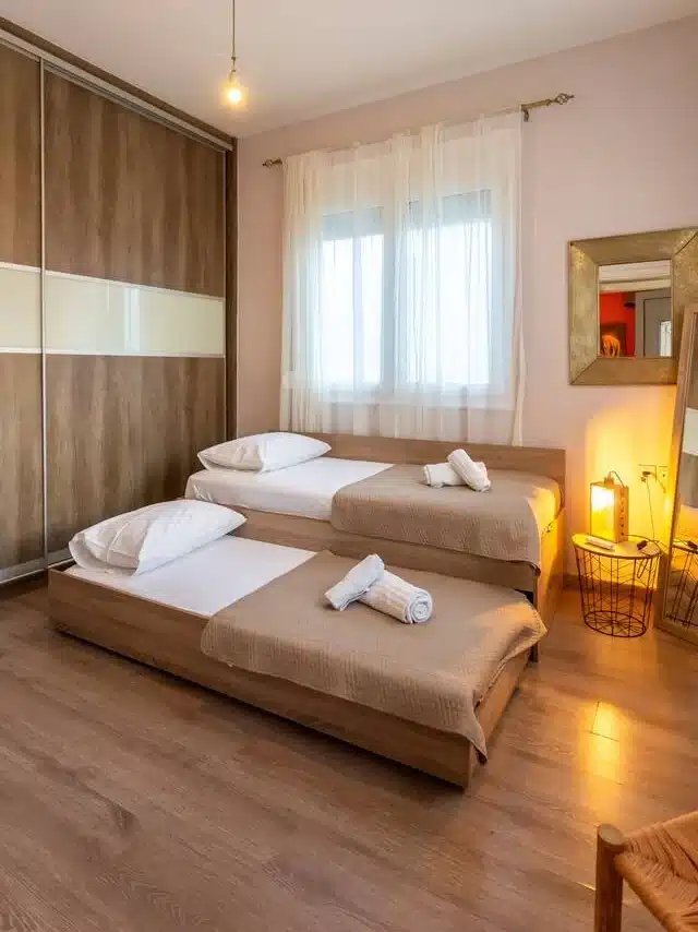 two single beds guest room at Ledeza Apartment, Igoumenitsa