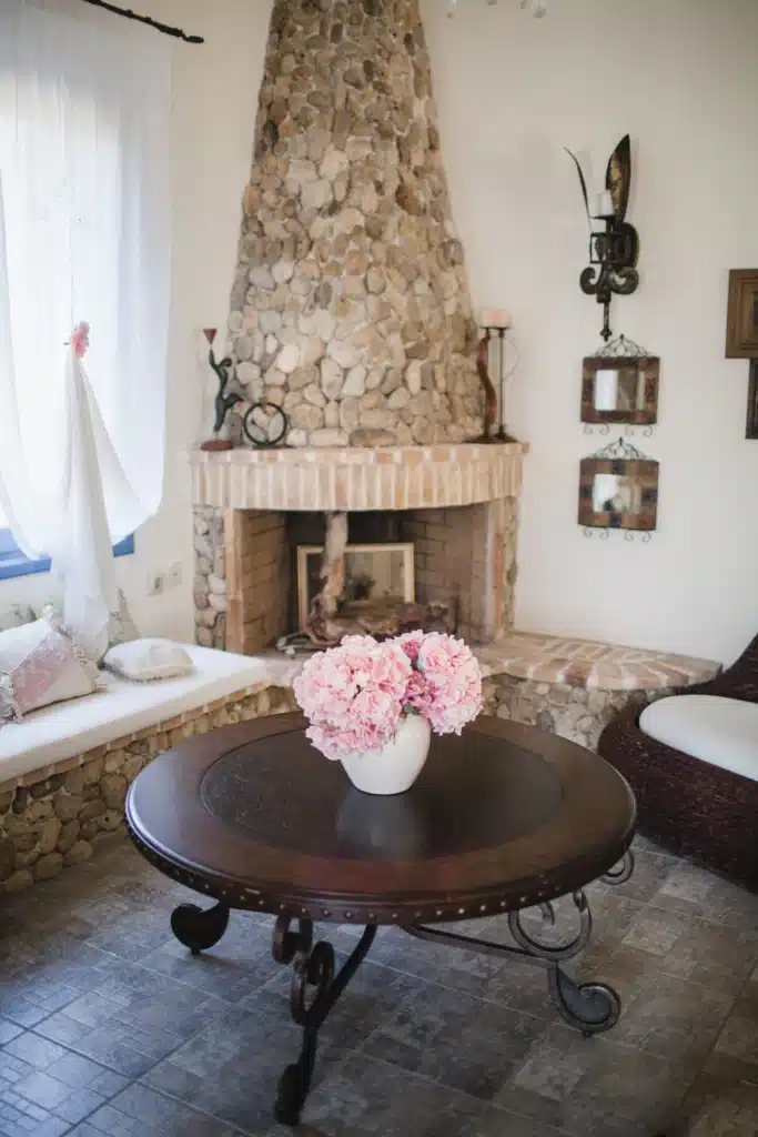 Stone fireplace corner in the living area at Casa di campagna