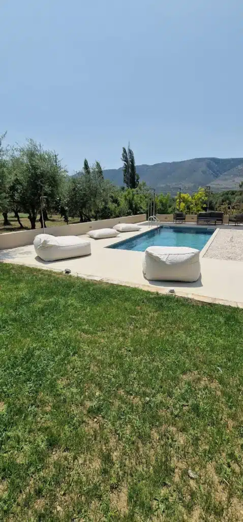 Private pool at Casa di campagna with lounge beds and beanbags